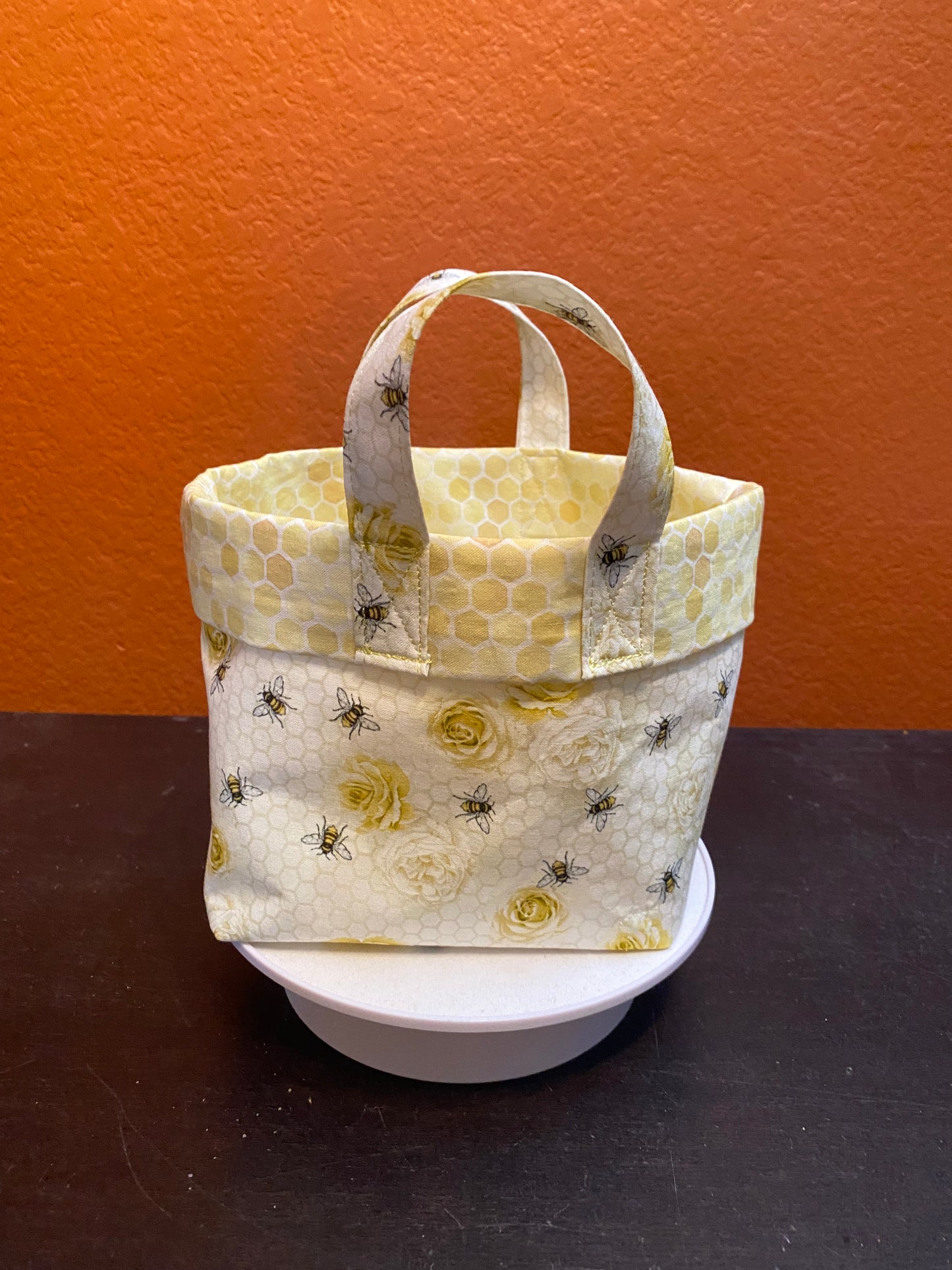 Honeybees and roses on honeycomb fabric basket