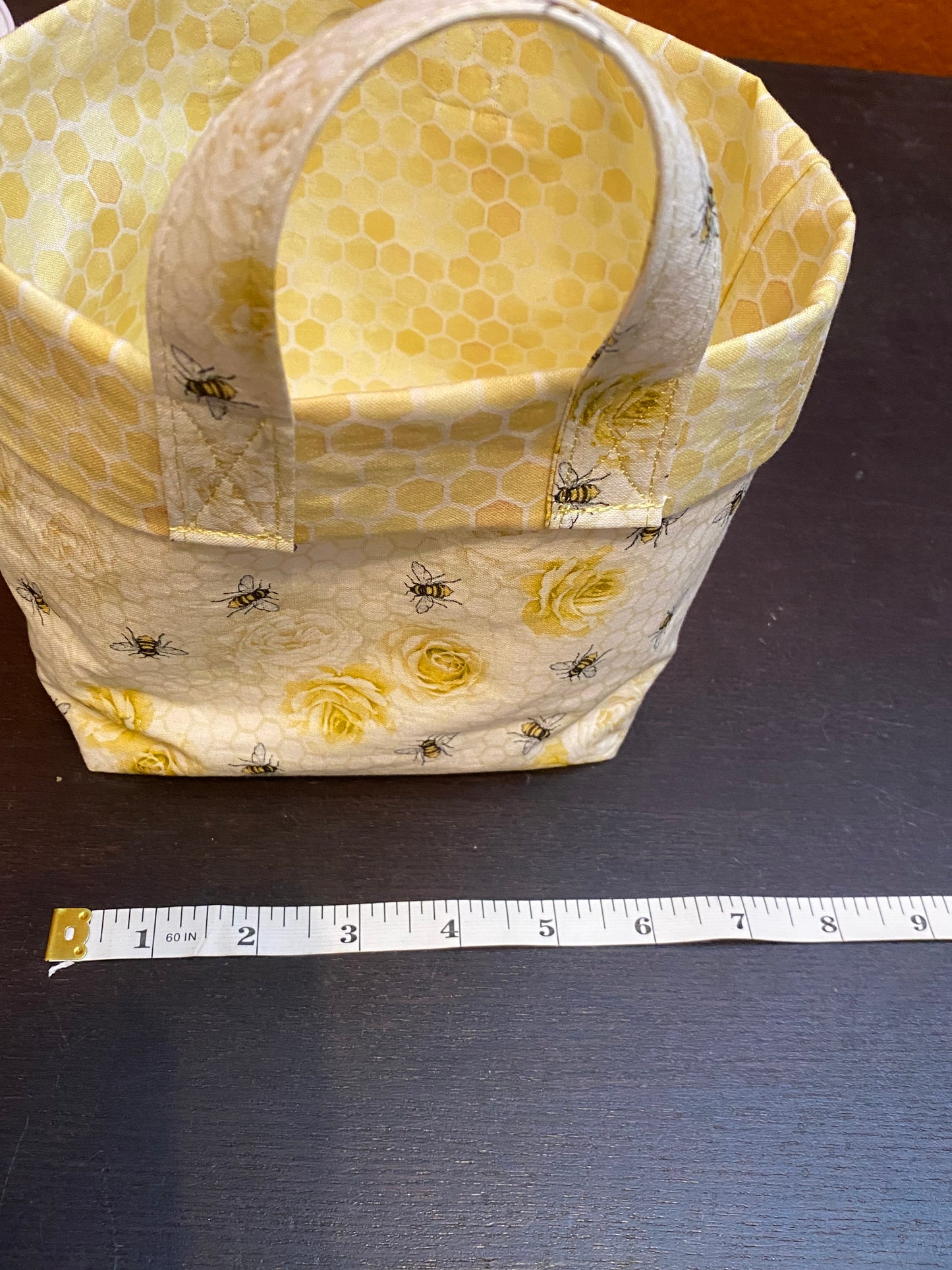 Honeybees and roses on honeycomb fabric basket