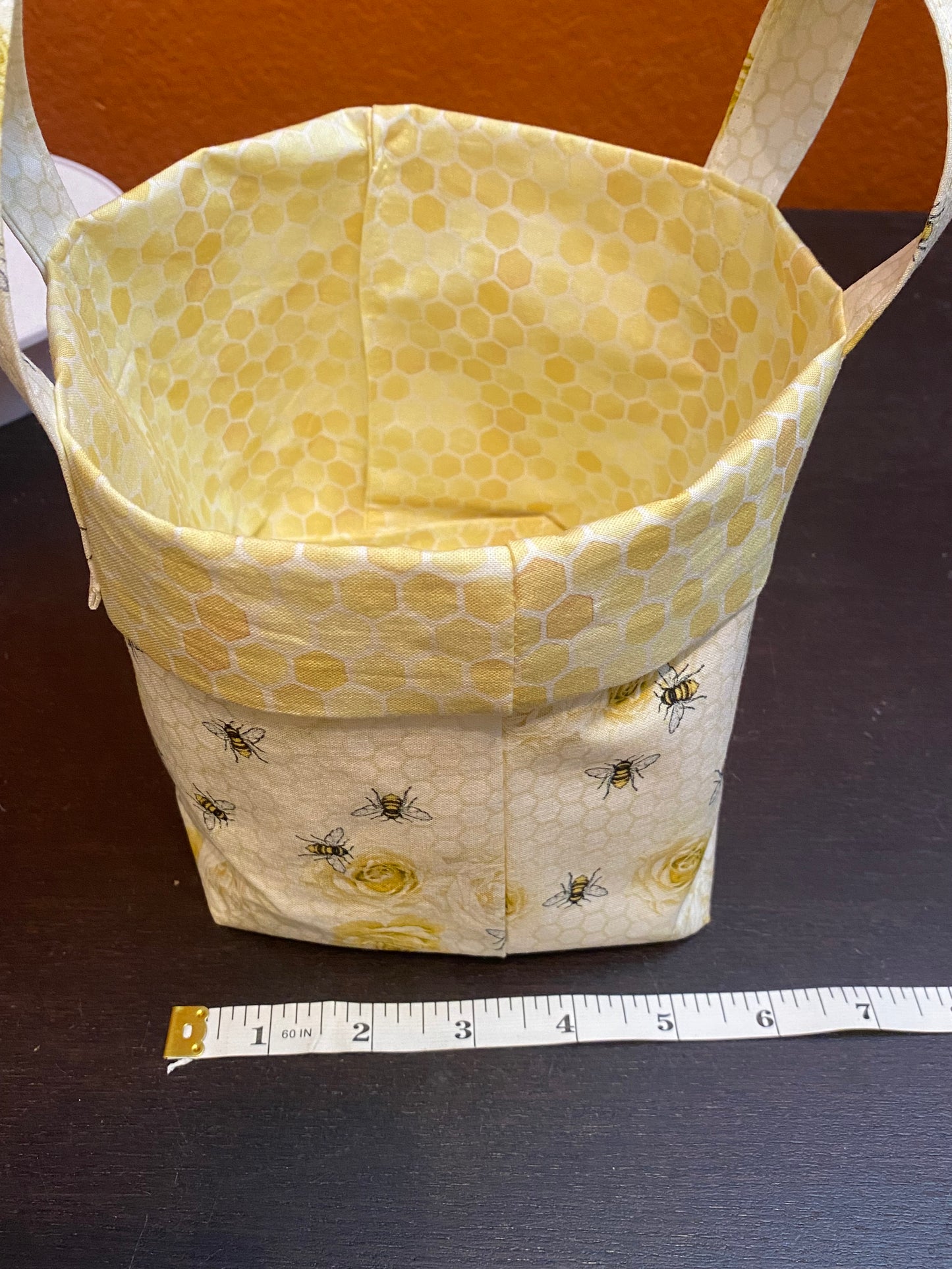 Honeybees and roses on honeycomb fabric basket