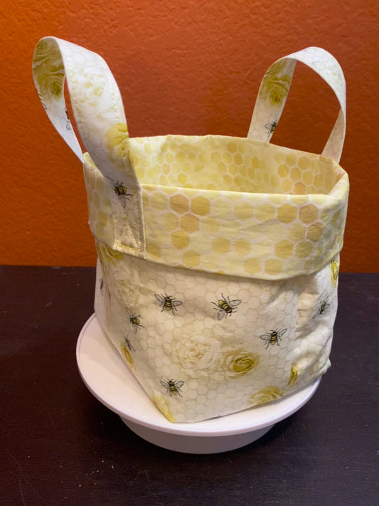 Honeybees and roses on honeycomb fabric basket